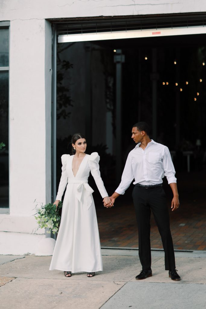 A Wilmington film wedding photographer captures a bi-racial couple at The Atrium on their wedding day.