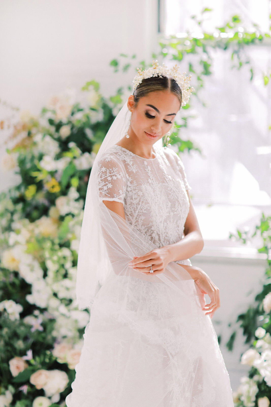 A bright floral bridal portrait session with a stylish Chana Marelus dress from Spina Bridal. Florals and styling by Kaleb Norman James, and photography by New York City film wedding photographer Lindley Battle.