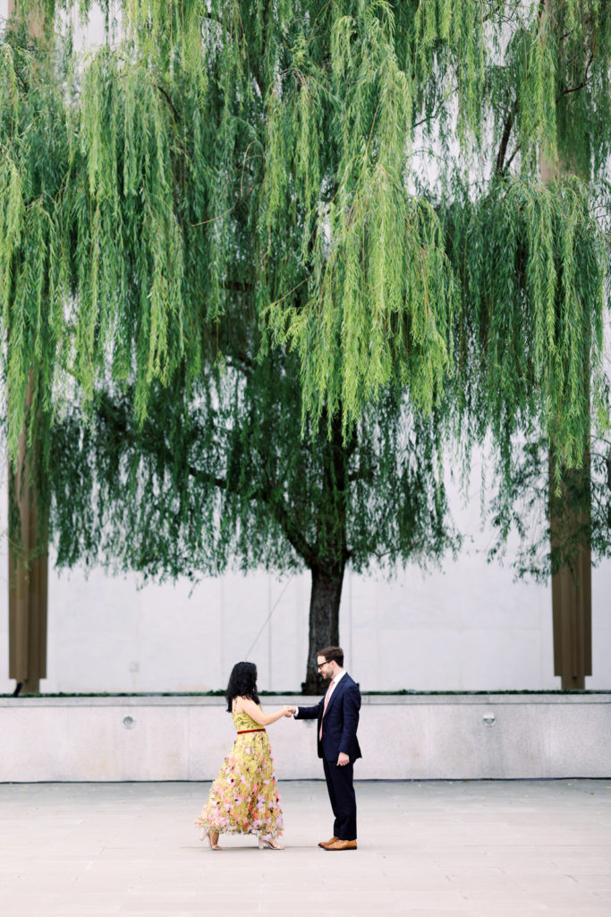 DC film wedding photographer photographs a stylish couple during their Kennedy Center engagement session.