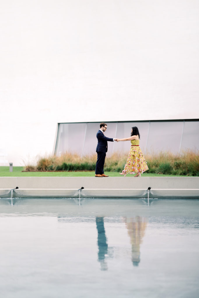 DC wedding photographer photographs a stylish couple during a modern engagement session at the Kennedy Center.